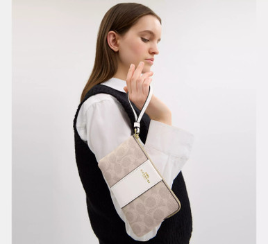 COACH Corner Zip Wristlet In Signature Canvas With Stripe image 16