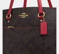 COACH Station Tote Bag In Maxi Signature Canvas Walnut/True Red (Arriving In Delhi) image 1