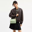 COACH Klare Crossbody Bag In Signature Leather - Gold/Pale Green (Arriving In Delhi) image 1